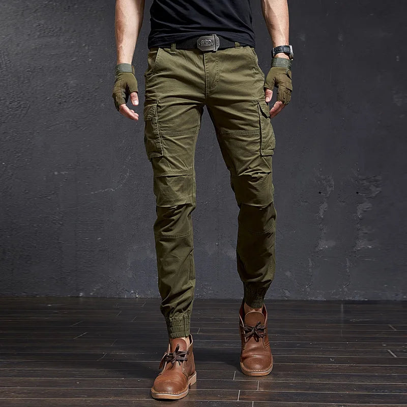 Men's tactical cargo pants, tapered fit, cuffed ankle. Rugged utility style for outdoor adventure.