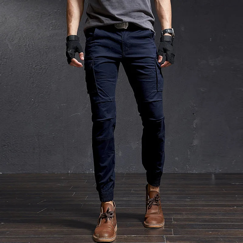 Men's durable tactical cargo pants with multi-pockets, tapered fit, cuffed ankle. Outdoor adventure gear.