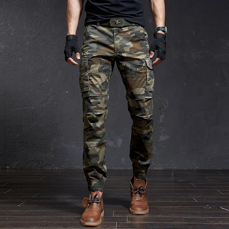 Stylish men's tapered fit cargo pants, cuffed ankle. Rugged utility pants for adventure or casual wear.