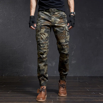 Stylish men's tapered fit cargo pants, cuffed ankle. Rugged utility pants for adventure or casual wear.