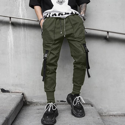 Casual men's techwear pants with multi-pockets, versatile for daily wear and urban fashion statements.