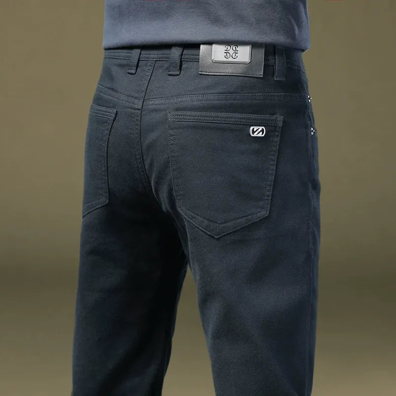 Men's tailored cotton trousers styled with a smart casual outfit, exuding refined modern fashion.