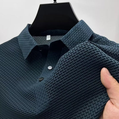 Men's tailored fit performance polo. Breathable, moisture-wicking fabric for golf or casual sophisticated wear.