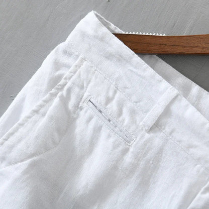 Full shot of a model wearing men's tailored linen shorts, ideal for comfortable summer casual outfits.