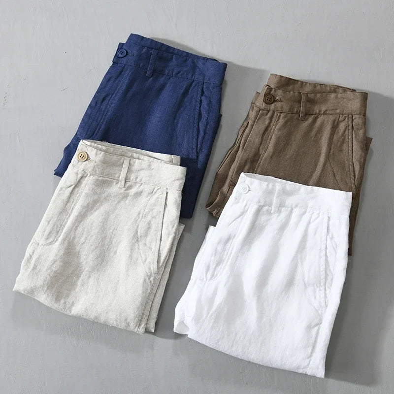 Detail of the waistband and button on men's tailored linen shorts, highlighting craftsmanship.