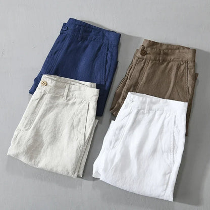 Detail of the waistband and button on men's tailored linen shorts, highlighting craftsmanship.