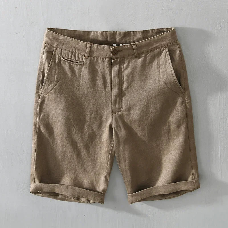 Pair of men's tailored linen shorts on a hanger, ready for a stylish, comfortable summer outfit.