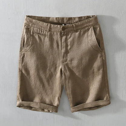 Pair of men's tailored linen shorts on a hanger, ready for a stylish, comfortable summer outfit.