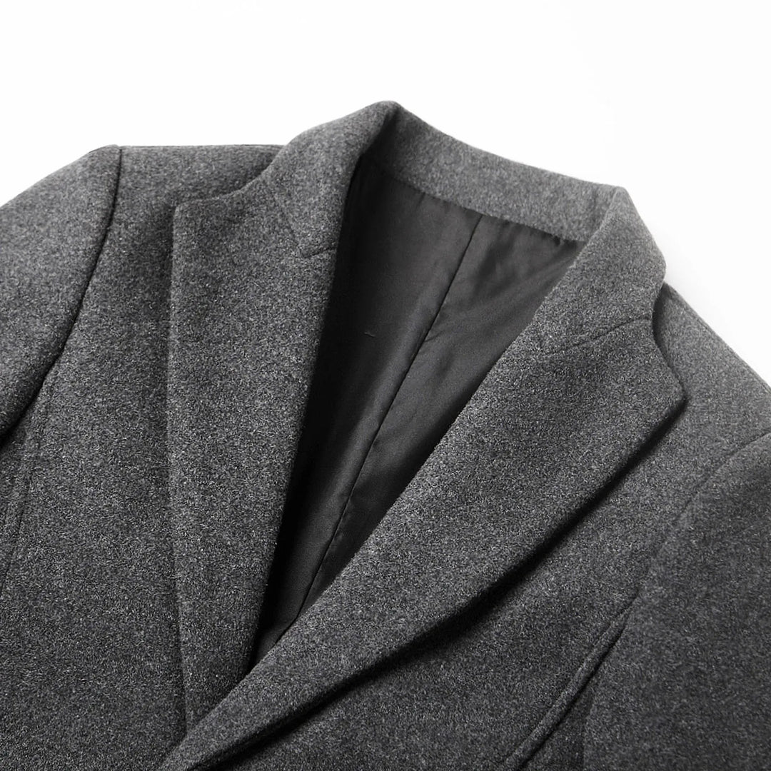 Stylish men's long tailored coat, featuring a classic notch lapel. Elegant fall & winter fashion for formal & casual.