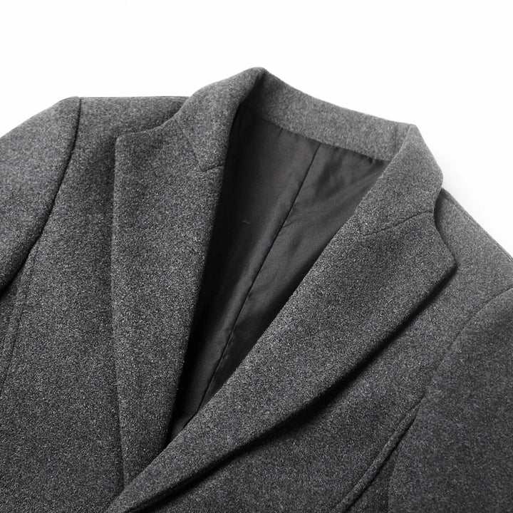 Stylish men's long tailored coat, featuring a classic notch lapel. Elegant fall & winter fashion for formal & casual.