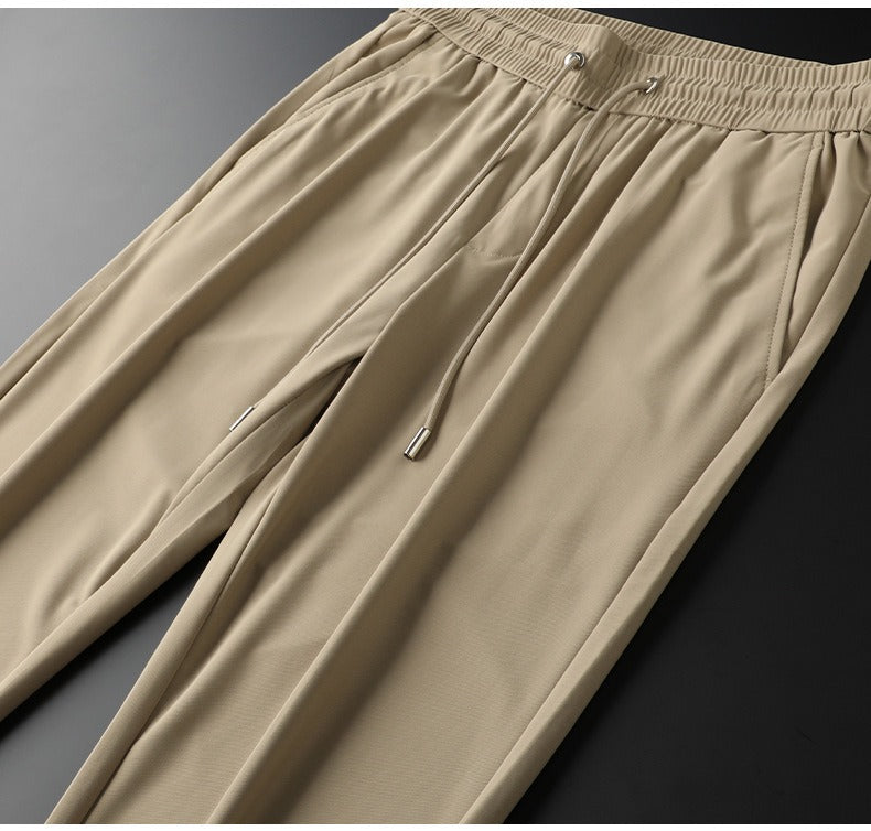 Man walking confidently in comfortable slim fit tailored cotton dress pants.