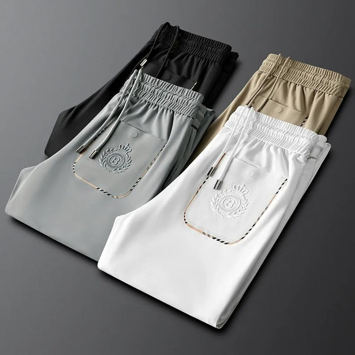 Close-up of the fine cotton fabric on men's tailored slim fit dress pants.