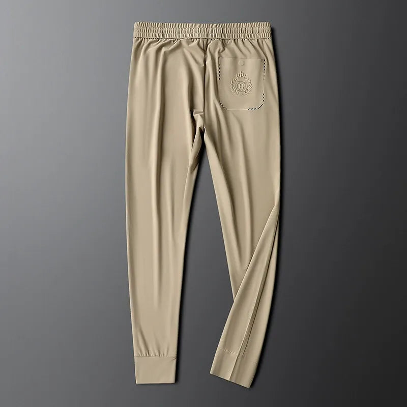 Side profile of sleek men's slim fit tailored cotton dress pants.