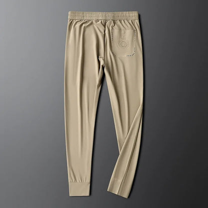 Side profile of sleek men's slim fit tailored cotton dress pants.