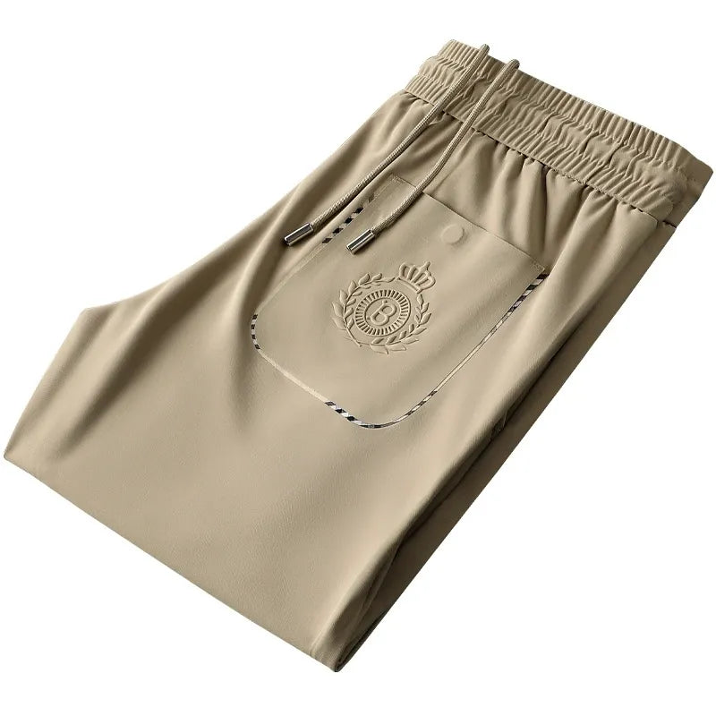 Back view of men's tailored slim fit trousers, highlighting the modern cut.