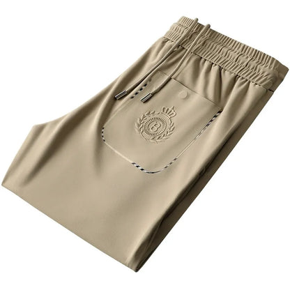 Back view of men's tailored slim fit trousers, highlighting the modern cut.