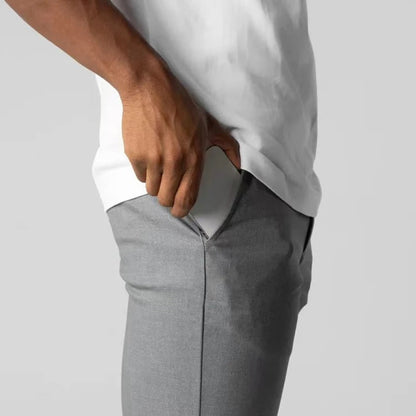 Modern men's stretch chinos with tailored fit. Wrinkle-resistant cotton blend casual comfort pants.