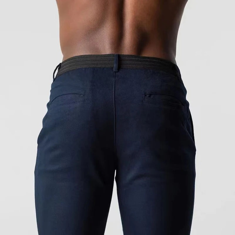 Men's tailored stretch chinos. Modern, comfortable cotton blend pants, perfect for versatile everyday wear.