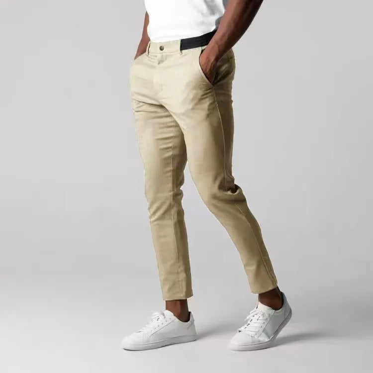 Modern men's comfort stretch chinos. Tailored fit cotton blend pants, wrinkle-resistant for versatile style.