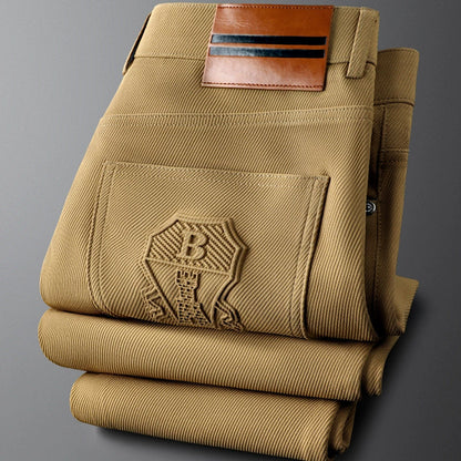 Men's tailored woven trousers with elegant leather accent for a sophisticated look.