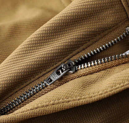 White men's tailored woven trousers with a refined leather accent, perfect for modern men's fashion.