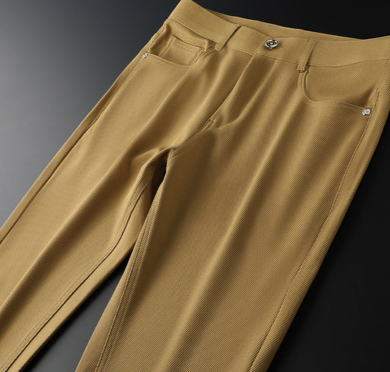 Stylish men's tailored woven pants featuring a unique leather accent, versatile for any occasion.