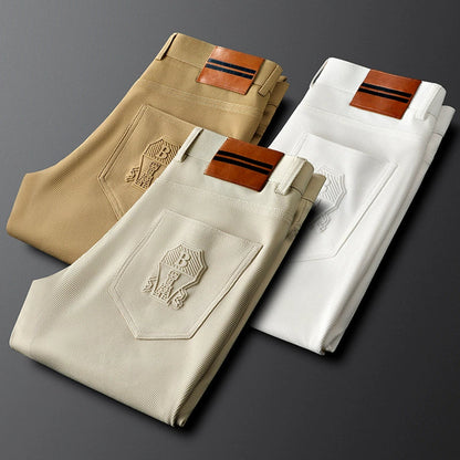 Men's formal khaki tailored woven trousers featuring a chic leather accent, great for office or events.