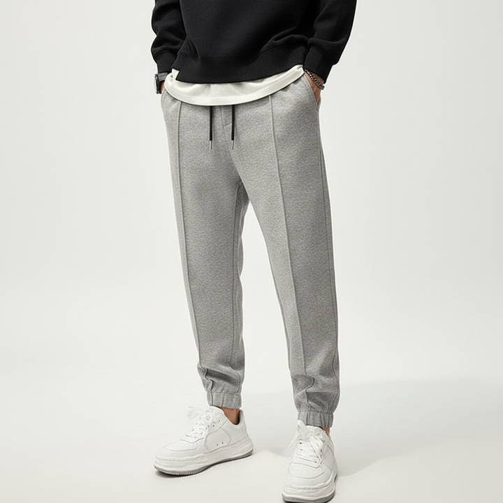 Performance men's sportswear pants, Tanner model, with comfortable elastic waist for active men's training.