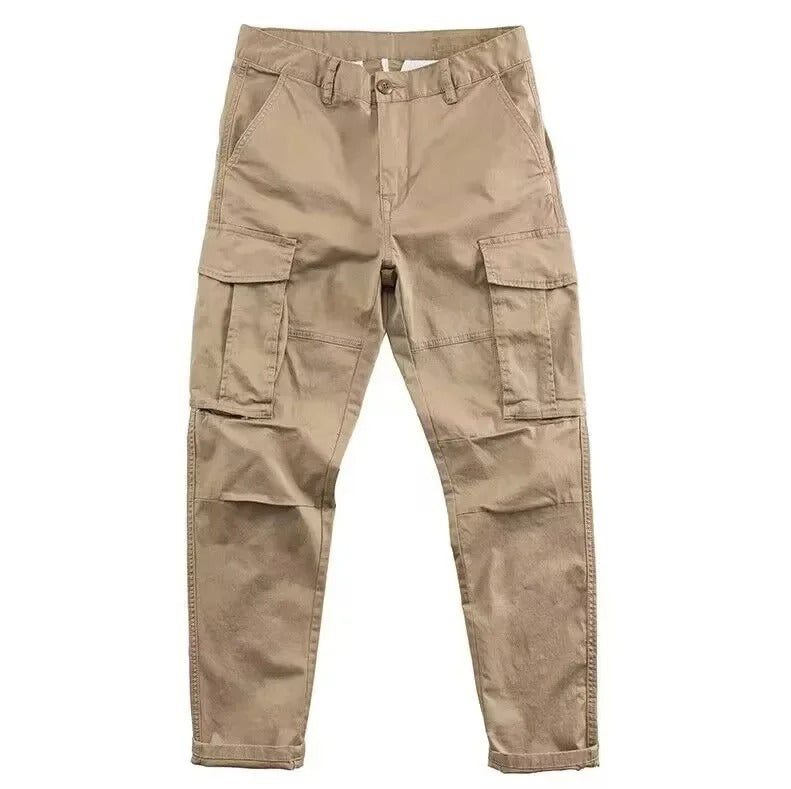 Detailed view of side pockets on men's tapered cargo pants, highlighting practical utility and design.