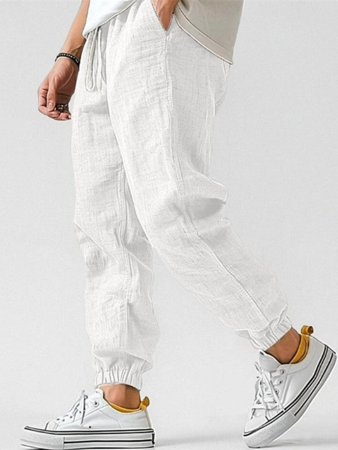 Versatile men's cuffed tapered trackpants, perfect for casual outings, travel, or relaxed spring fashion.