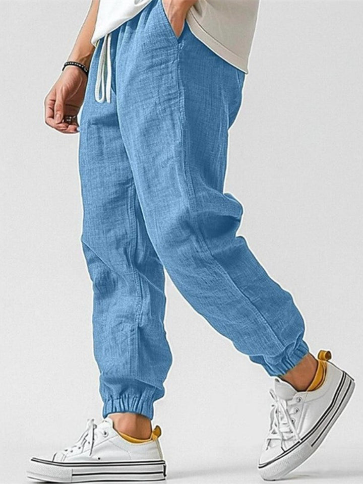 Stylish men's cuffed joggers, comfortable & versatile for everyday wear, travel, or a relaxed spring look.