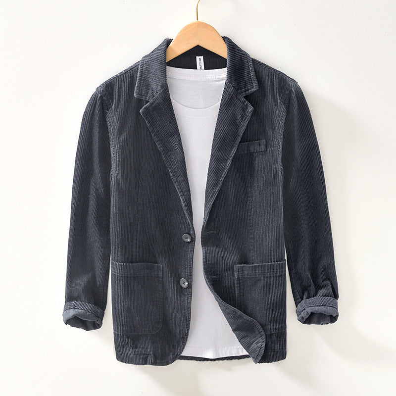 Close-up of a men's casual blazer jacket, highlighting its unique texture and modern design.