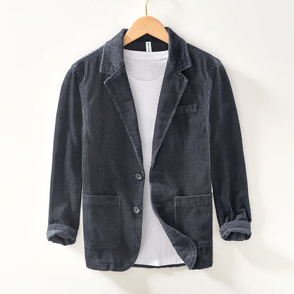 Close-up of a men's casual blazer jacket, highlighting its unique texture and modern design.