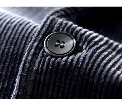 Detail of a men's casual textured blazer jacket lapel, showcasing quality and fall style.