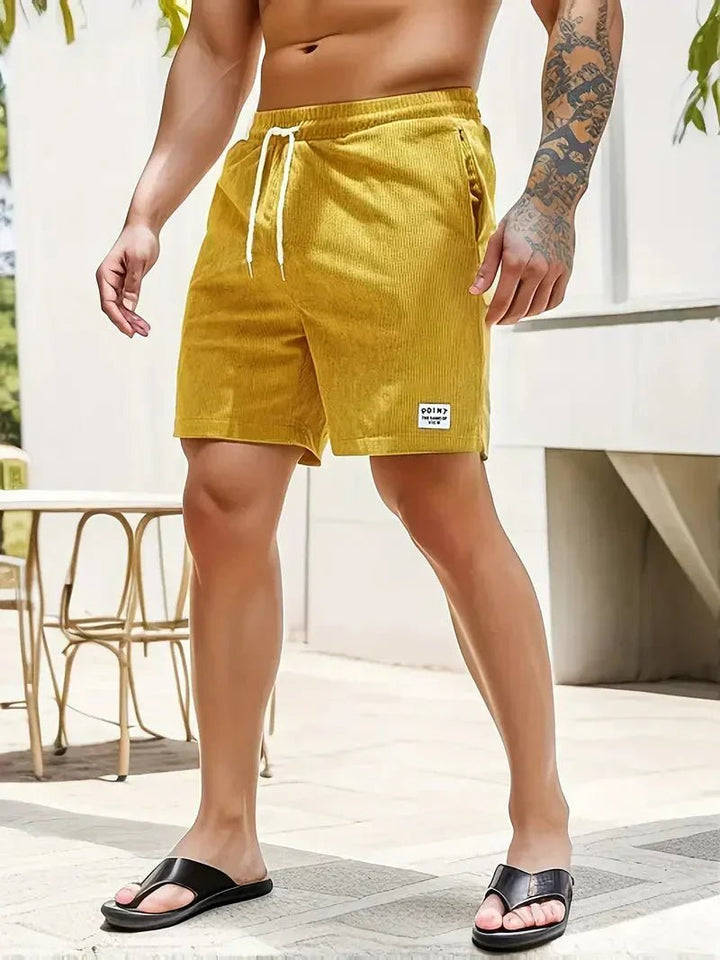 Men's comfortable textured drawstring shorts, perfect for casual summer outings & lounge wear.