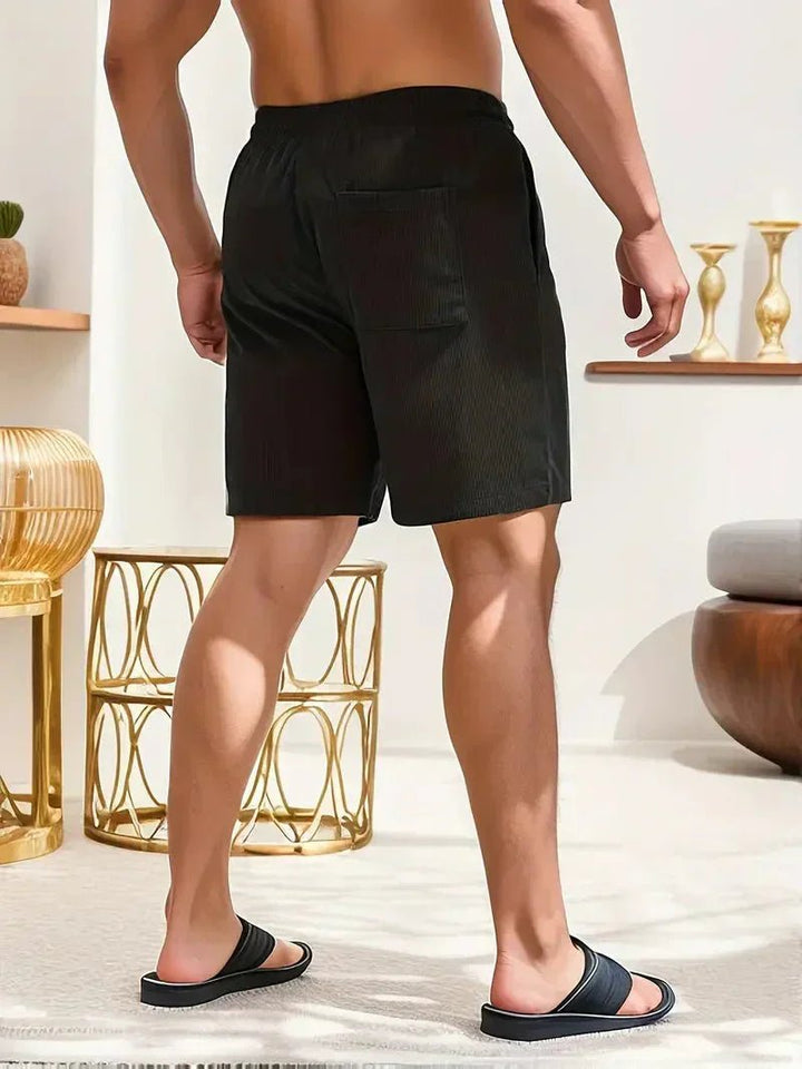 Contemporary men's textured drawstring shorts. Stylish, comfortable, & relaxed for casual summer days.