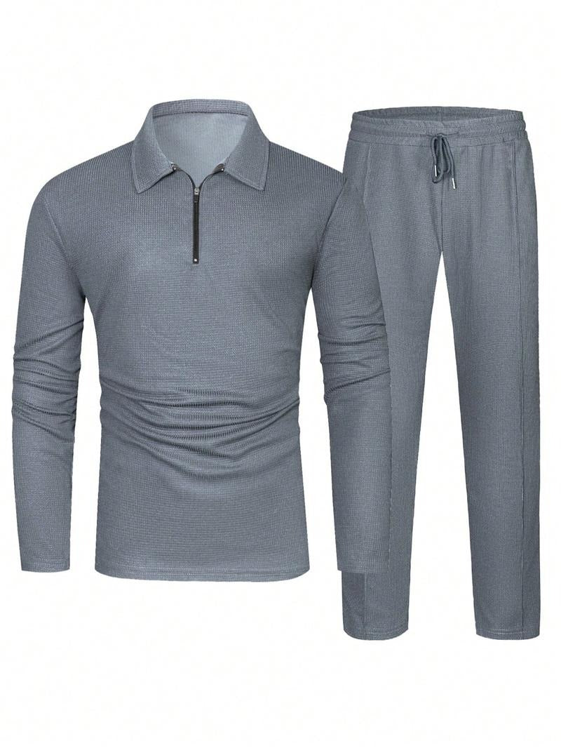 Men's two-piece lounge set: zip neck top and drawstring pants. Comfortable textured knit cotton blend for relaxation.