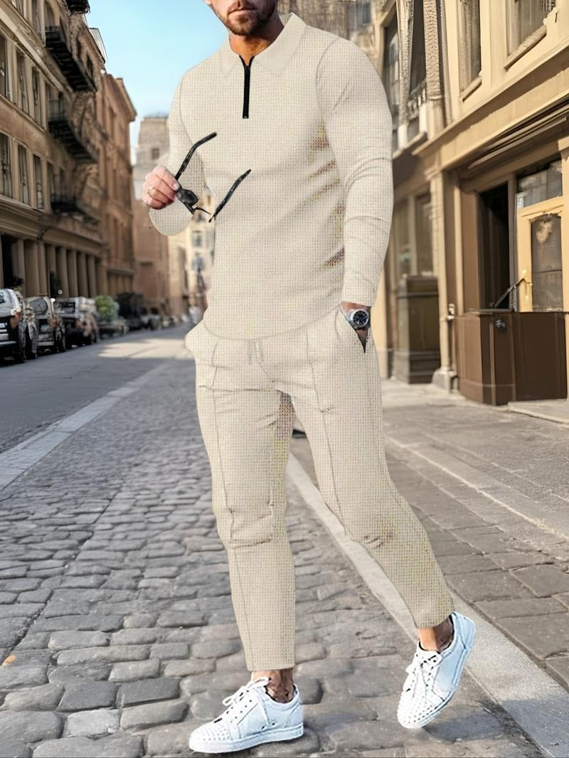 Men's zip neck lounge set featuring textured knit cotton blend fabric and comfortable drawstring pants for leisure.