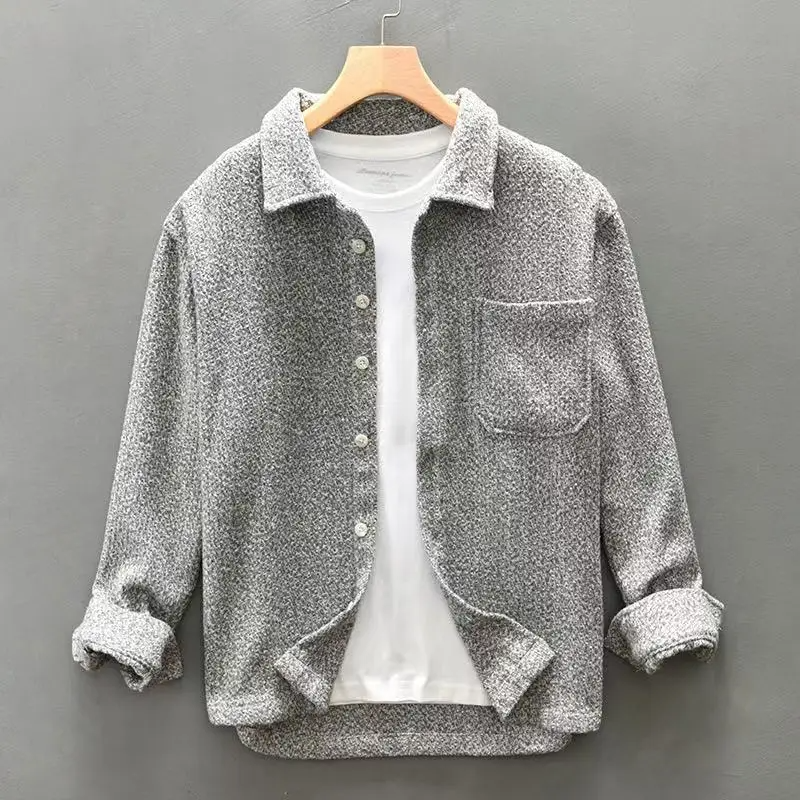 Comfortable men's textured button-up shirt, ideal for fall fashion, casual everyday wear & layering.