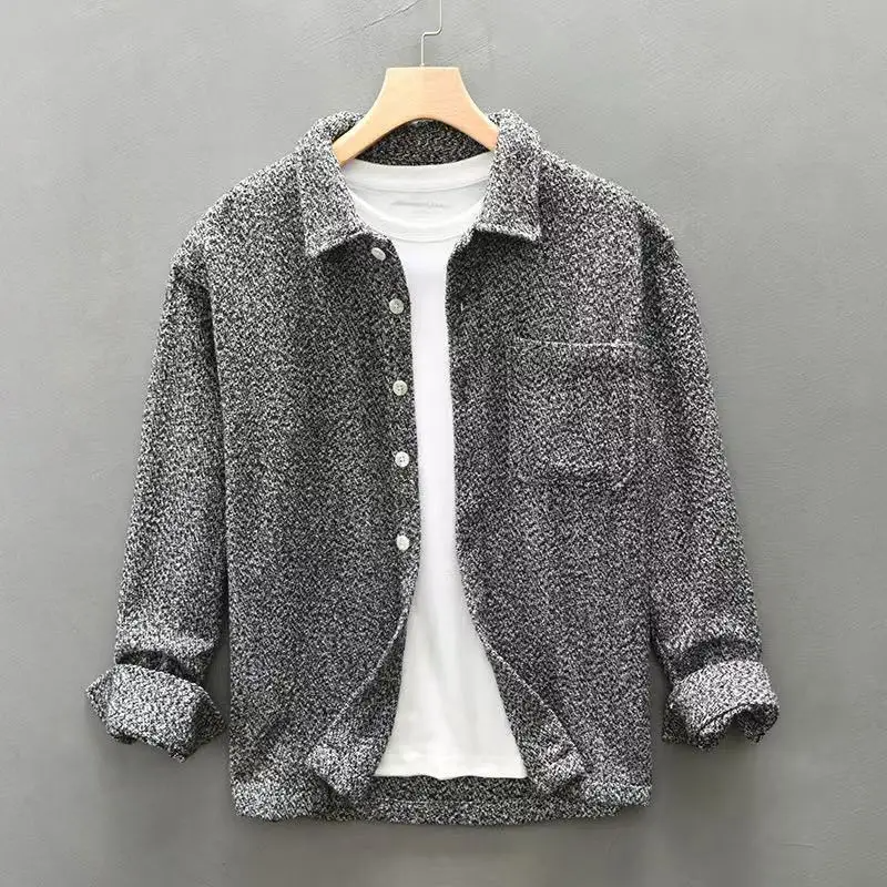 Stylish men's long-sleeve textured button-up for smart casual looks or versatile layering options.