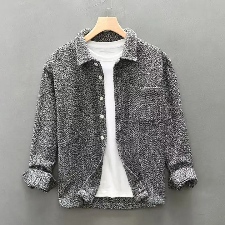 Stylish men's long-sleeve textured button-up for smart casual looks or versatile layering options.
