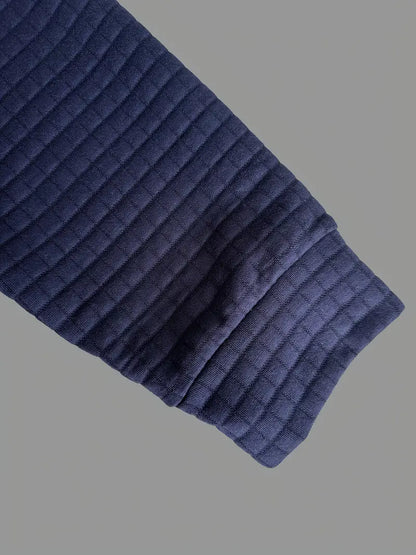 Fine-textured men's long sleeve polo with a neat button placket, great for casual to smart-casual looks.
