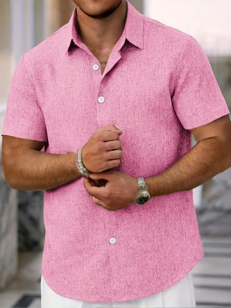Close-up of men's textured polo shirt fabric & button-down collar. Stylish regular fit short sleeve casual top.