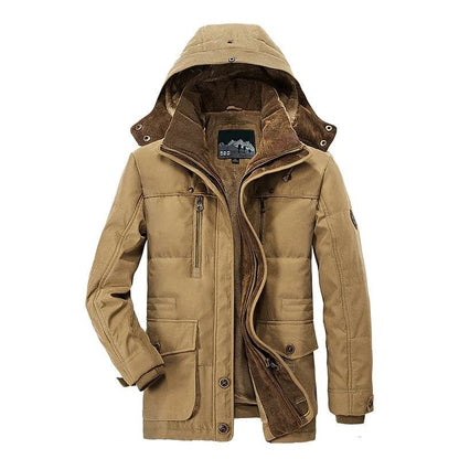 Man wearing a warm thermal winter parka, ideal for cold weather activities. Insulated men's jacket with ultimate warmth.