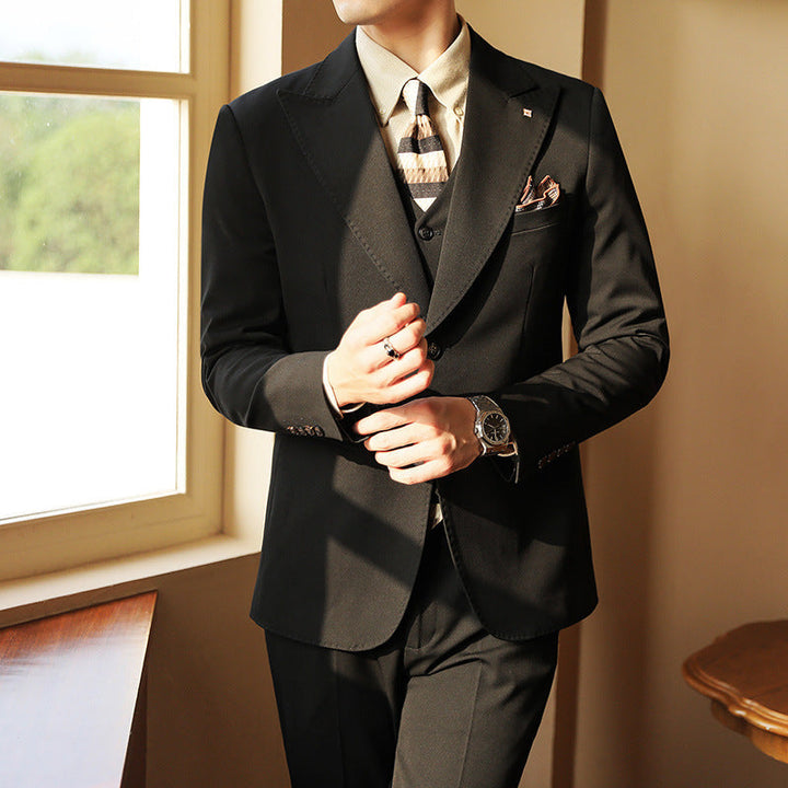 Black slim fit three-piece men's suit. Perfect formal wear for weddings, business & special events.