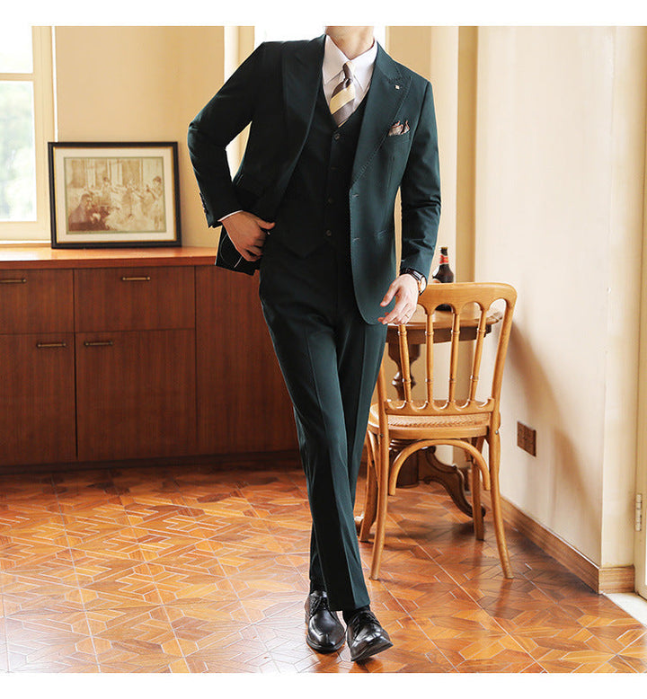 Sophisticated men's three-piece wedding suit. Tailored formal attire for grooms & special occasions.