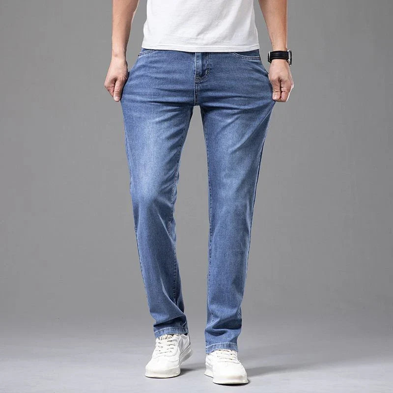 Men's casual straight fit blue denim jeans with stretch cotton for all-day comfort and a modern look.
