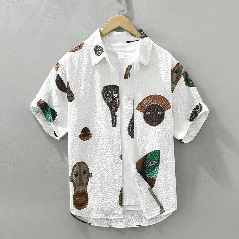 Men's tribal art print button-up shirt. Features abstract Cubist design, perfect for unique casual wear.
