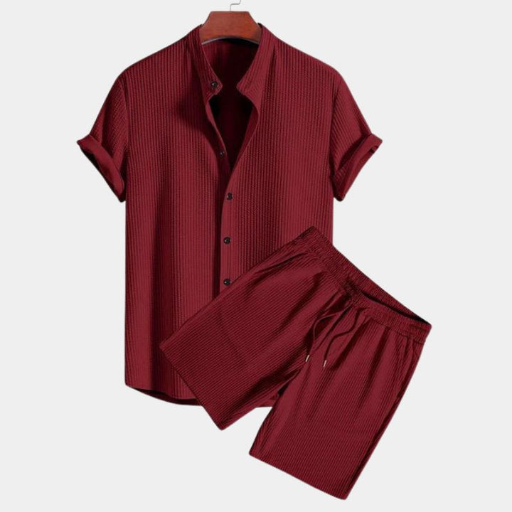 Breathable men's casual two-piece polo set with a unique mandarin collar. Comfortable for summer, relaxed fit styling.