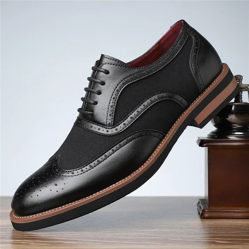 Classic men's two-tone wingtip brogue oxfords, elegant footwear for formal occasions.